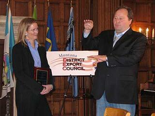 SRS Crisafulli, President, Laura M. Fleming, is shown receiving the award from Governor Schweitzer