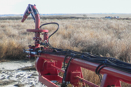 Slurry pump with spray nozel and hydraulic lift for wheels