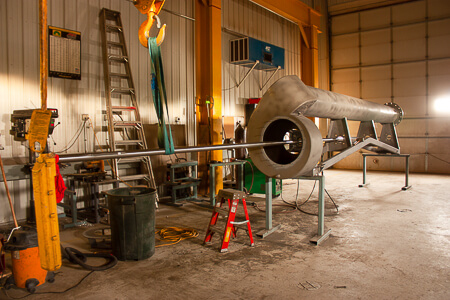 Shaft being placed in Trailer Pump